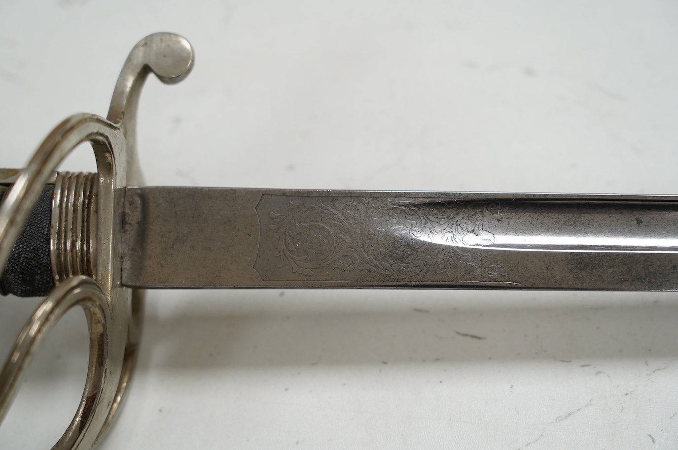 A George VI Royal Artillery officer’s sword, regulation etched blade and plated triple bar guard, blade 85.5cm. Condition - good
